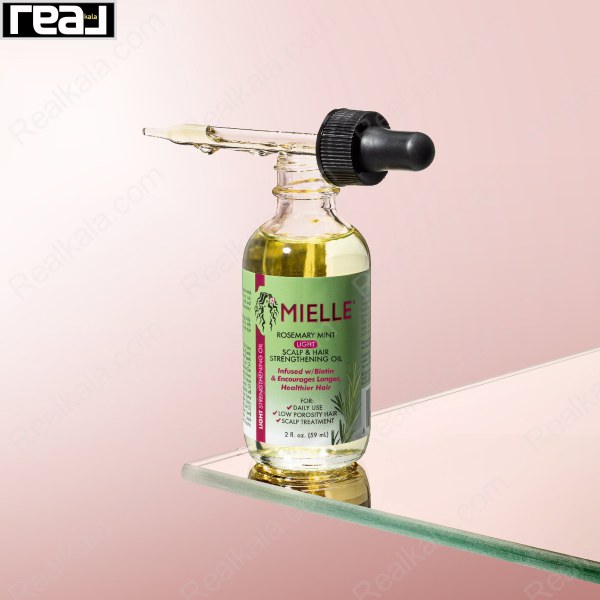 نمای واقعی از روغن Mielle با قطره‌ چکان مشکی