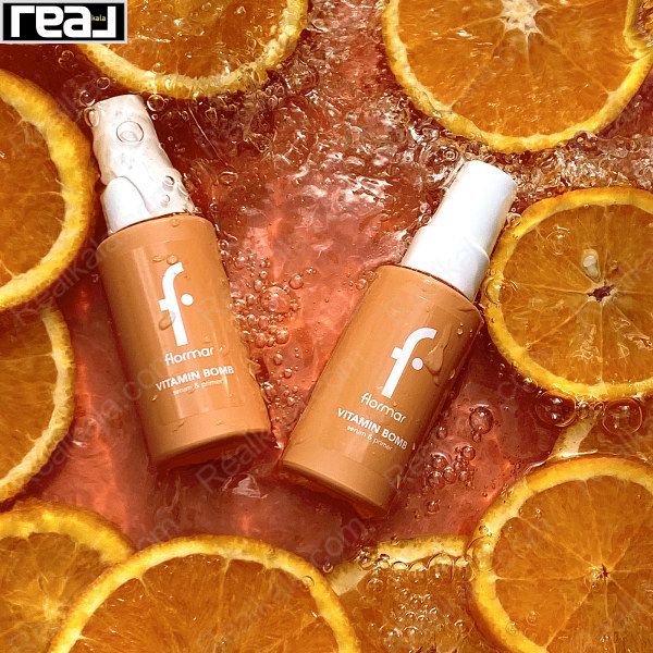 نمای دوتایی از بطری‌های Vitamin Bomb فلورمار در مایع نارنجی با برش پرتقال	